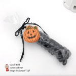 Candy filled 2x6 cellophane bag makes an ideal Halloween Treat. It has been topped with Stampin' Up! Seasonal Chums Jack o lantern by Stamp Candy