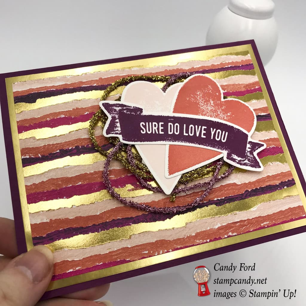 Here's a shiny gold and pink Valentine card made with the Sure Do Love You stamp set, Lots to Love Box Framelits Dies, Painted with Love Designer Series Paper DSP, Love Mini Tinsel Trim Combo Pack, by Stampin' Up! #stampcandy