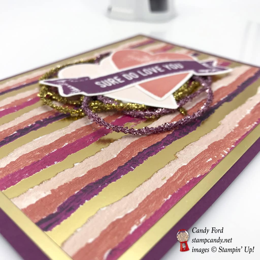 Here's a shiny gold and pink Valentine card made with the Sure Do Love You stamp set, Lots to Love Box Framelits Dies, Painted with Love Designer Series Paper DSP, Love Mini Tinsel Trim Combo Pack, by Stampin' Up! #stampcandy